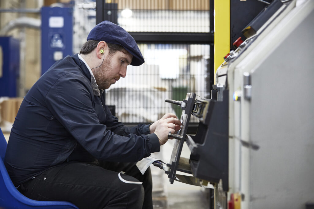 We Seal engineer performing maintenance on bag sealing machine