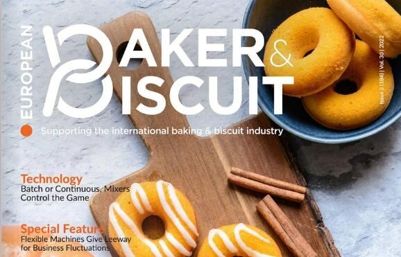 Baker and Biscuit Magazine Cover with orange pumpkin and party ring biscuits along with sticks of cinnamon. A featured story on bag sealing and bread packaging is highlighted